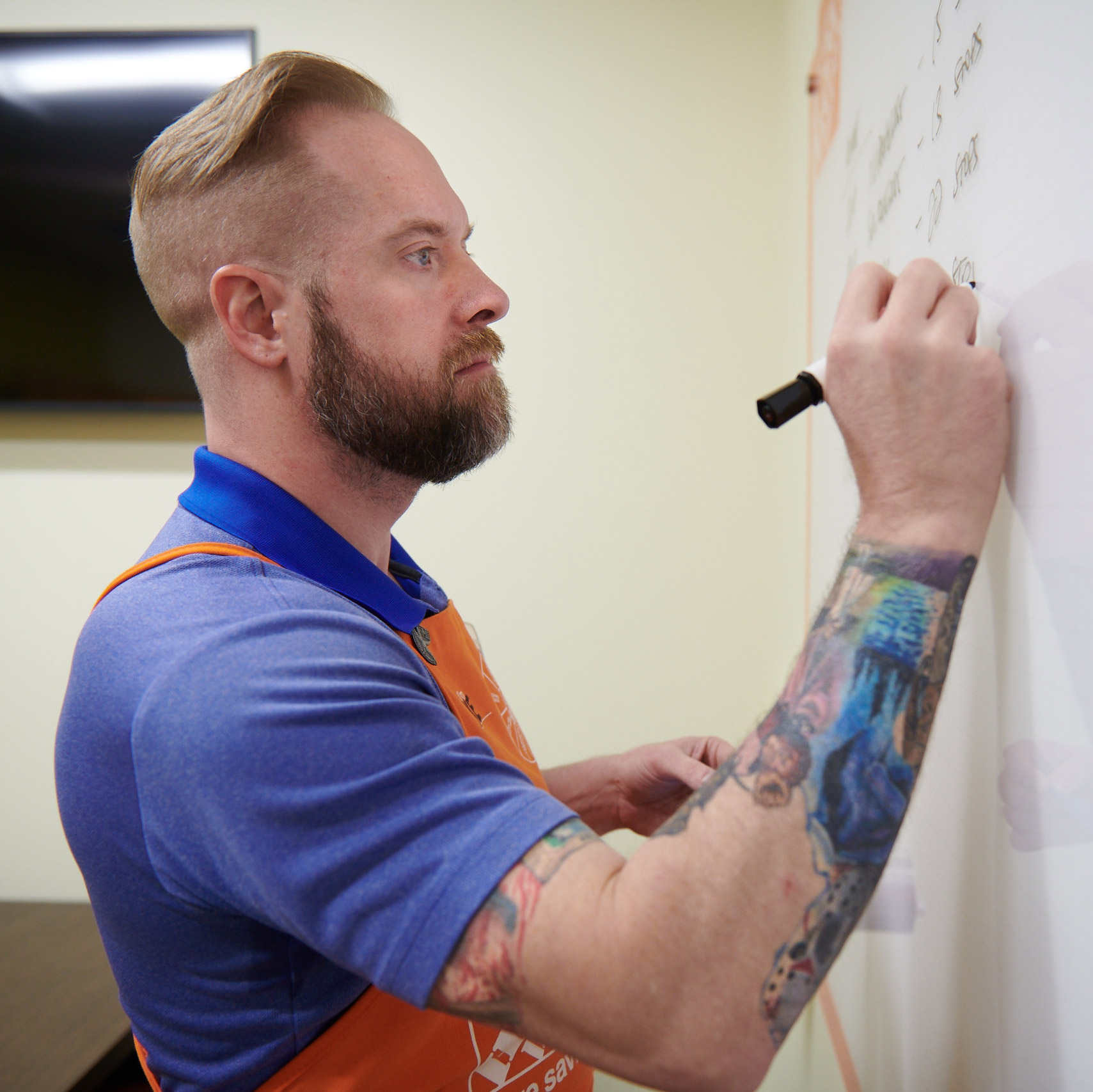 Man writing on whiteboard